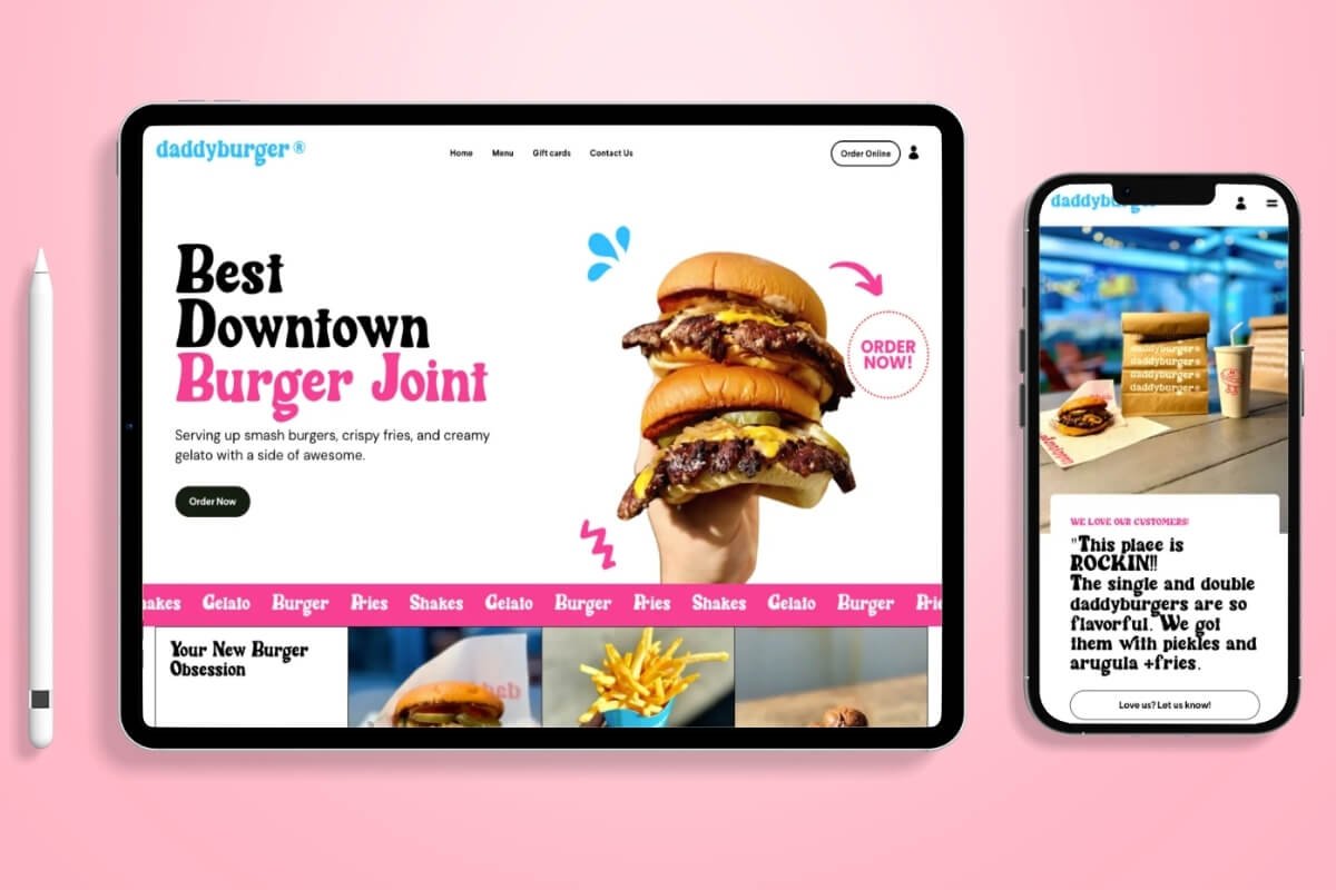 A website displayed on a tablet and a smartphone featuring a burger restaurant called 'daddybürger'. The tablet shows an image of a large burger with two beef patties, cheese, and bun, with the text 'Best Downtown Burger Joint' and an order button. The smartphone shows a smaller image of a burger, fries, and drinks with customer reviews.