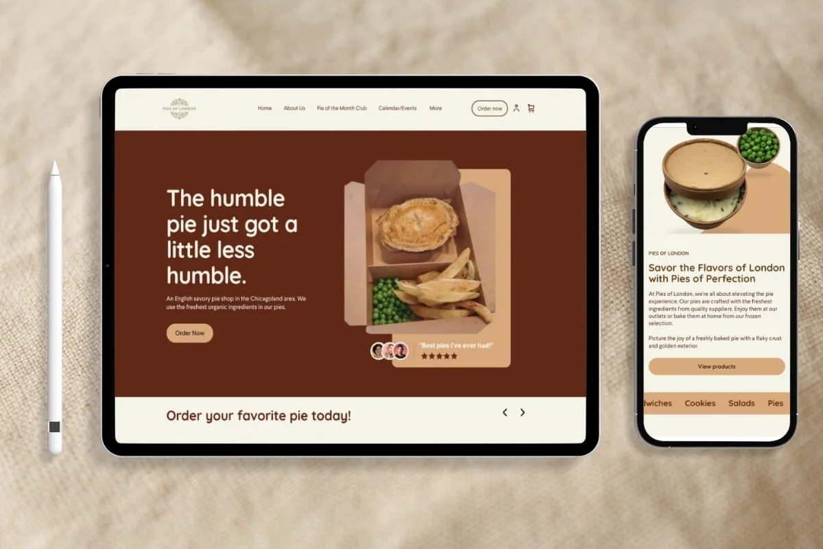 Tablet and smartphone displaying website for a pie shop with images of pies and text promoting pie orders, placed on a beige surface with a stylus.