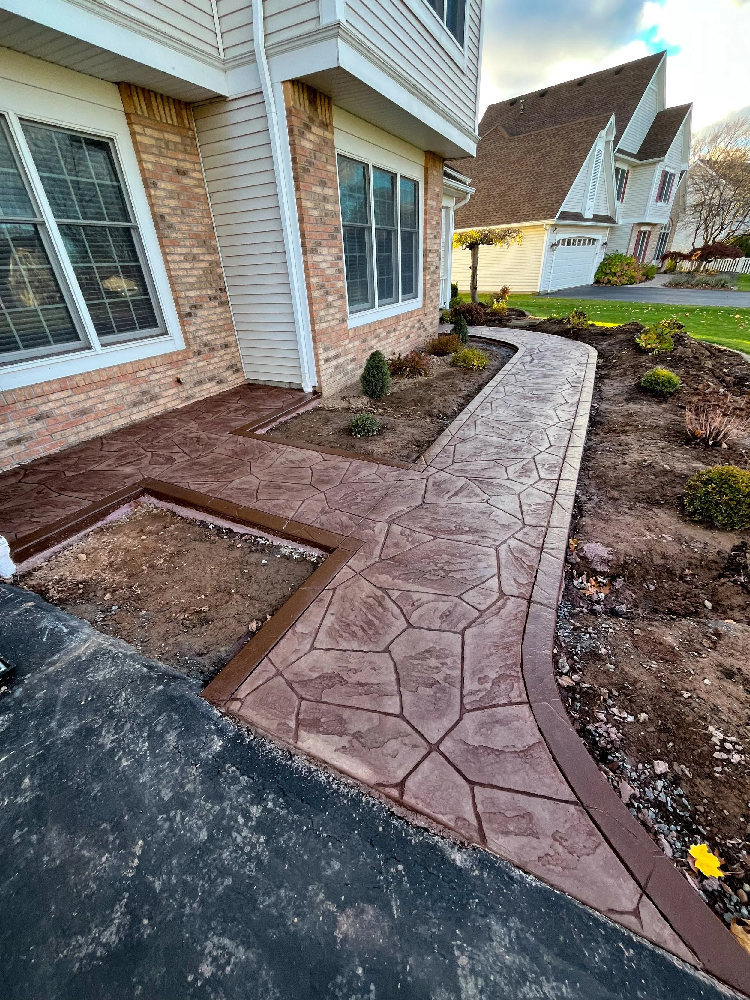 Greece, NY Stamped Concrete Patio by Rochester Patio Pros