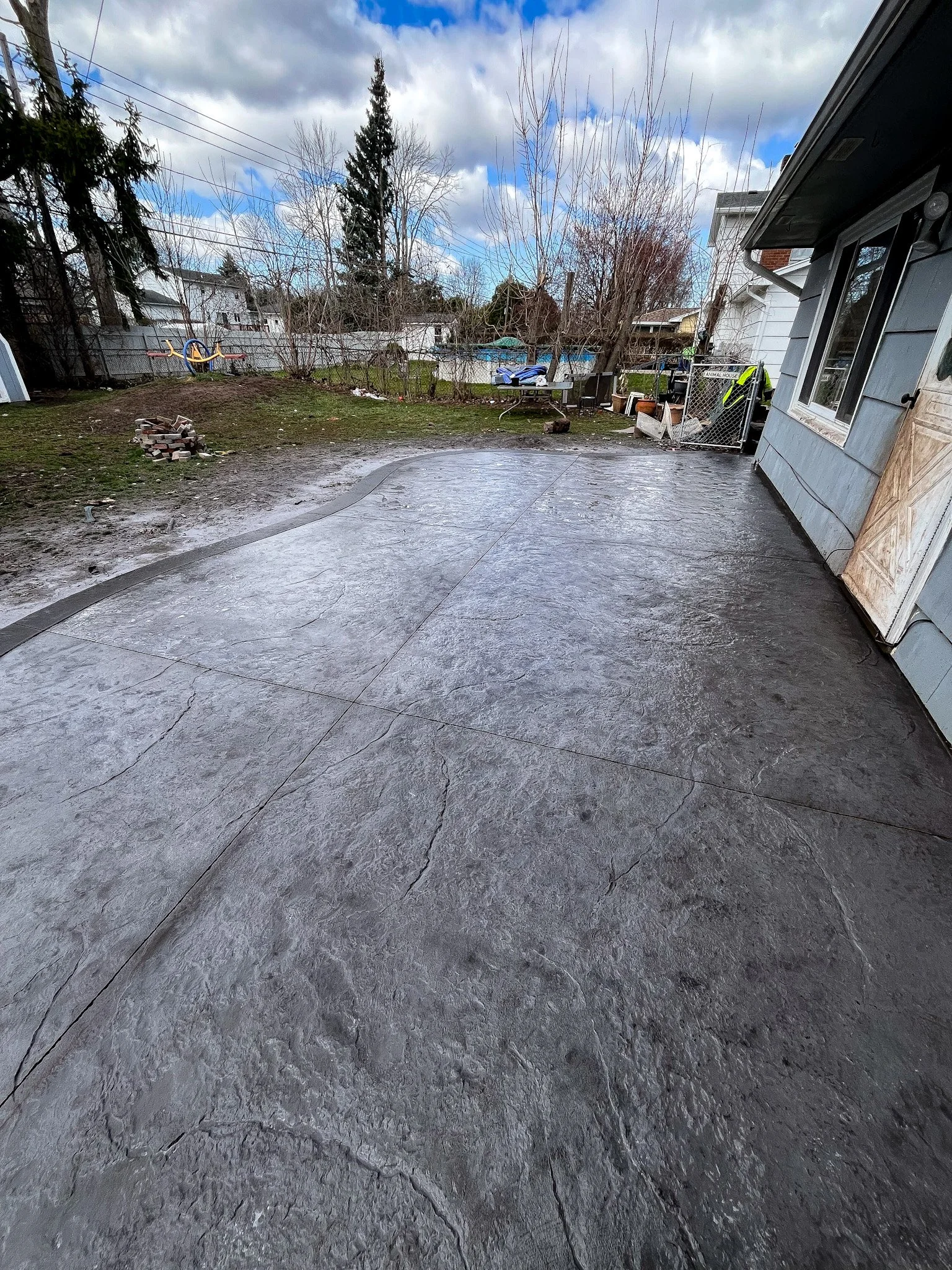 Greece, NY Stamped Concrete Patio by Rochester Patio Pros