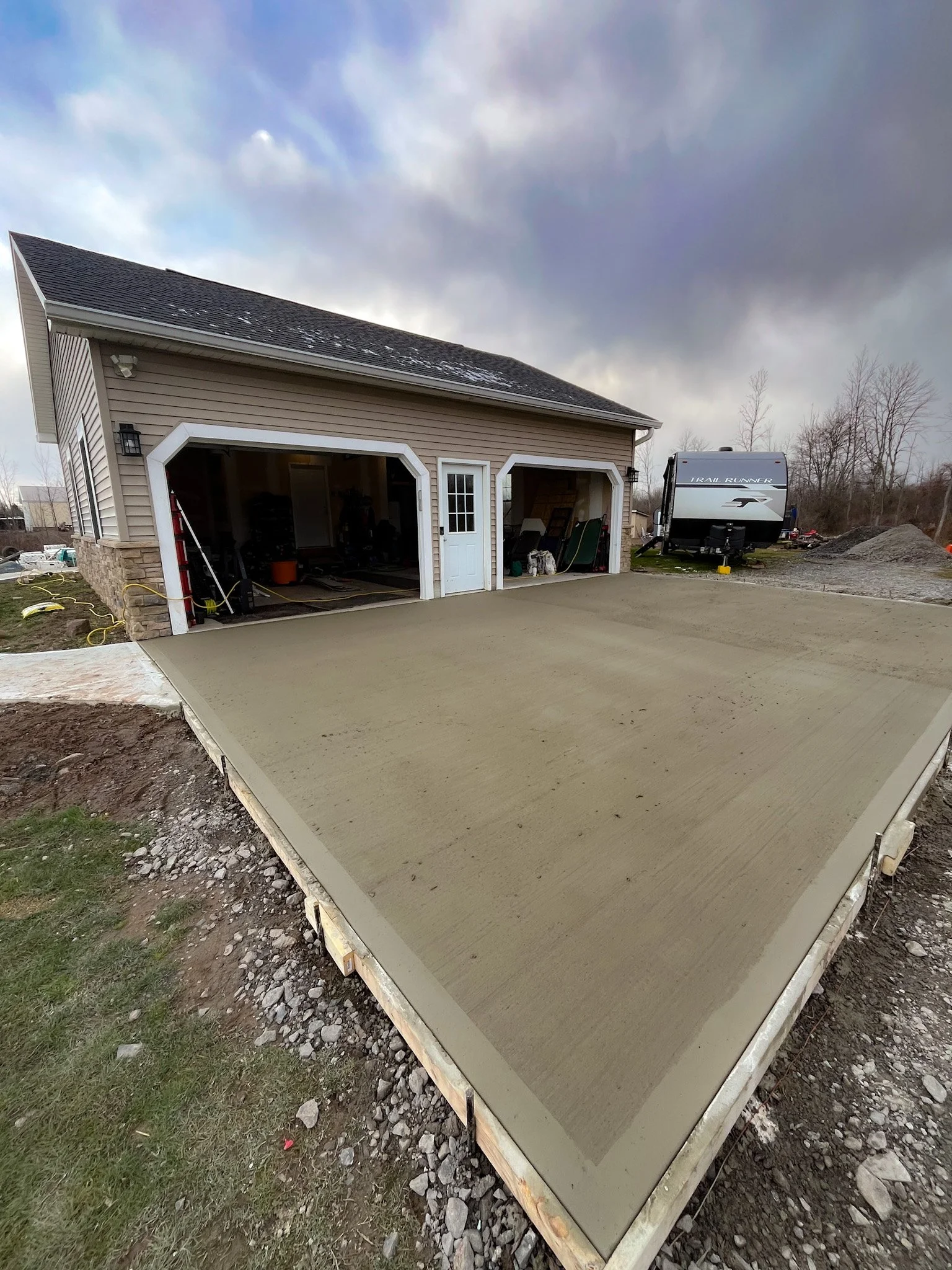 Brockport, NY Broomed Concrete Driveway by Rochester Patio Pros 30ft x 20ft