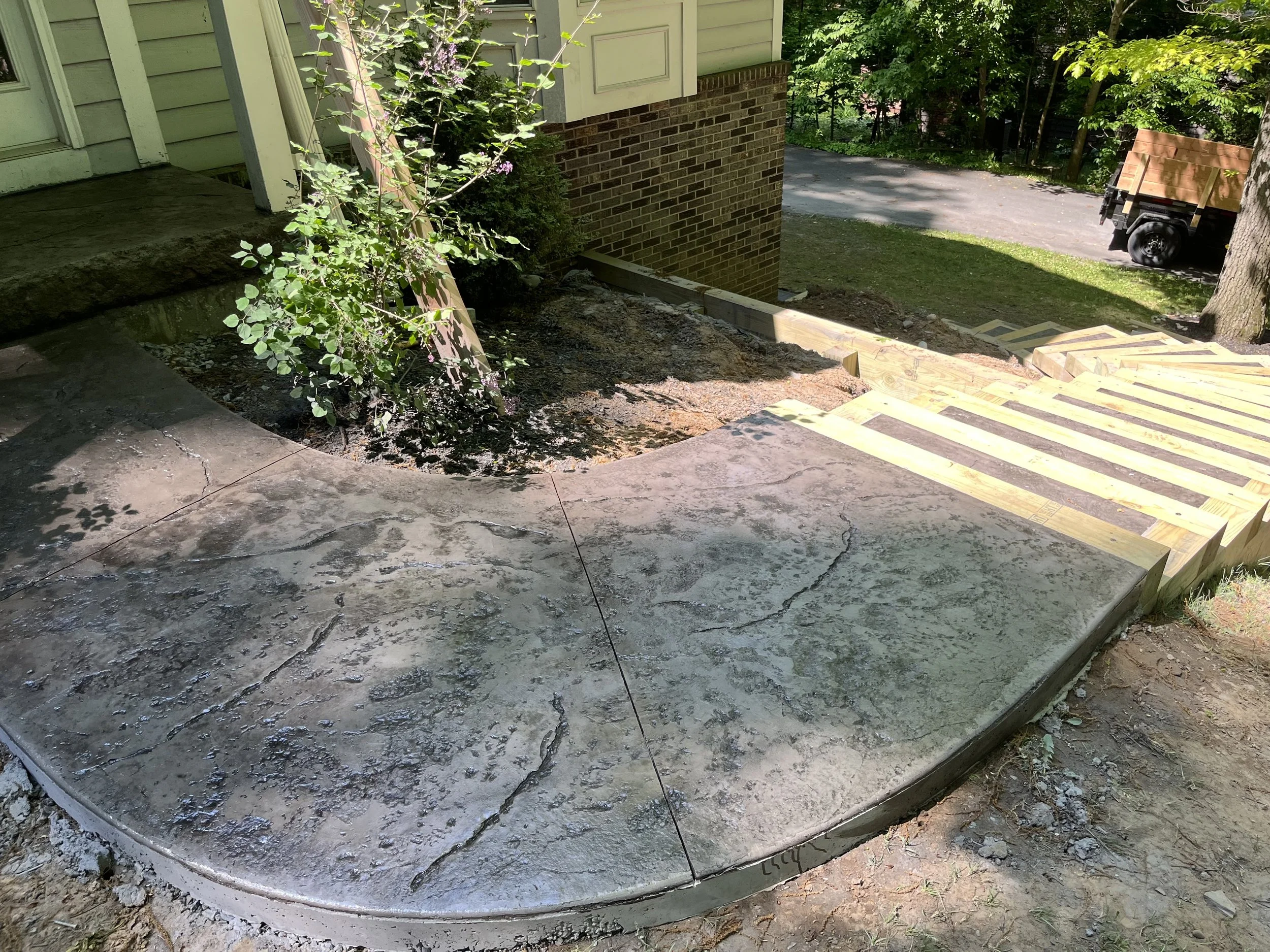 Curved stamped concrete sidewalk in Rochester, NY