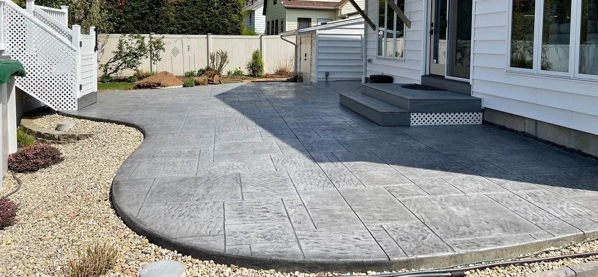 Stamped concrete patio with wood steps