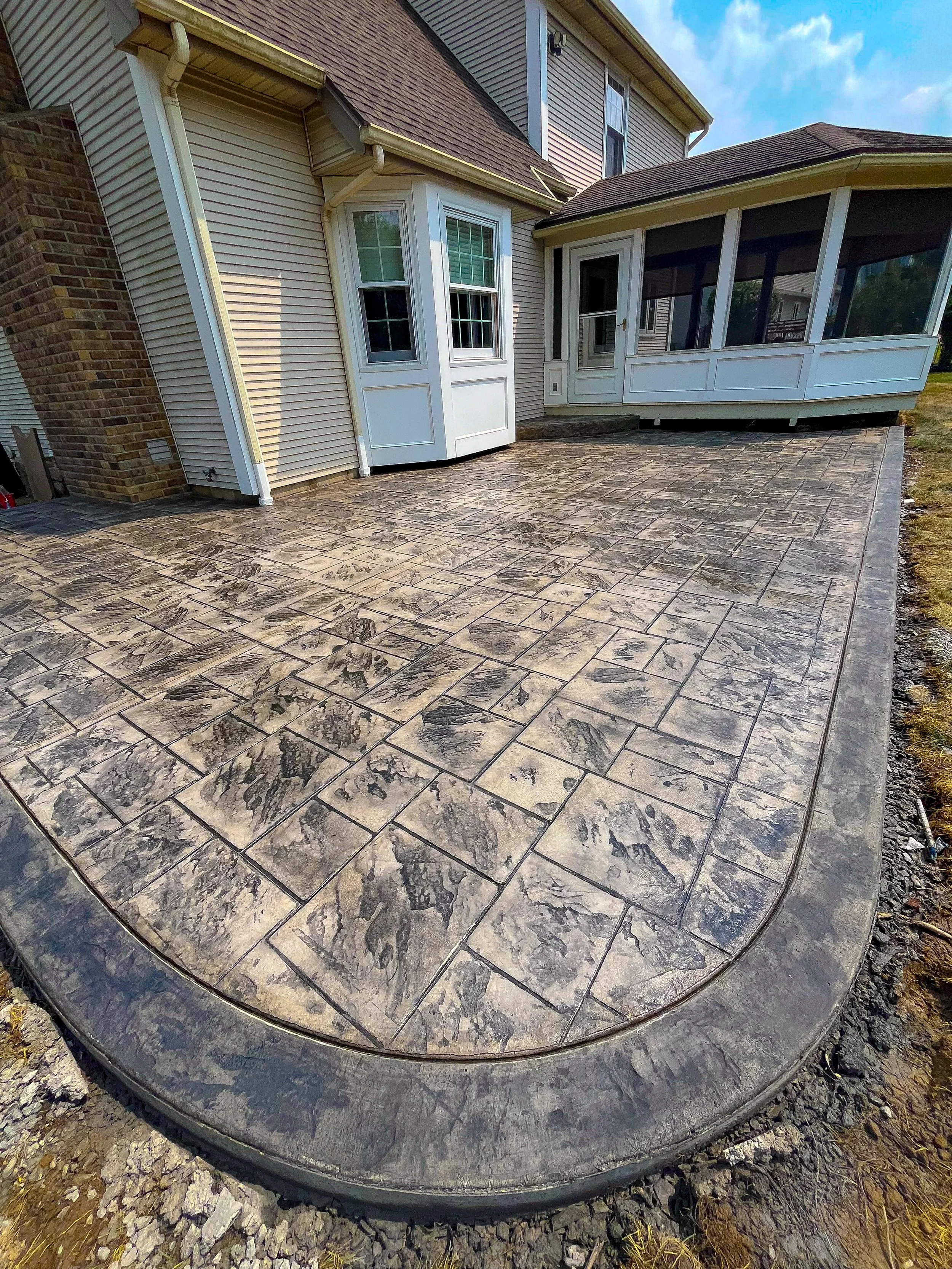 Notched Ashlar stamped patio with dark border