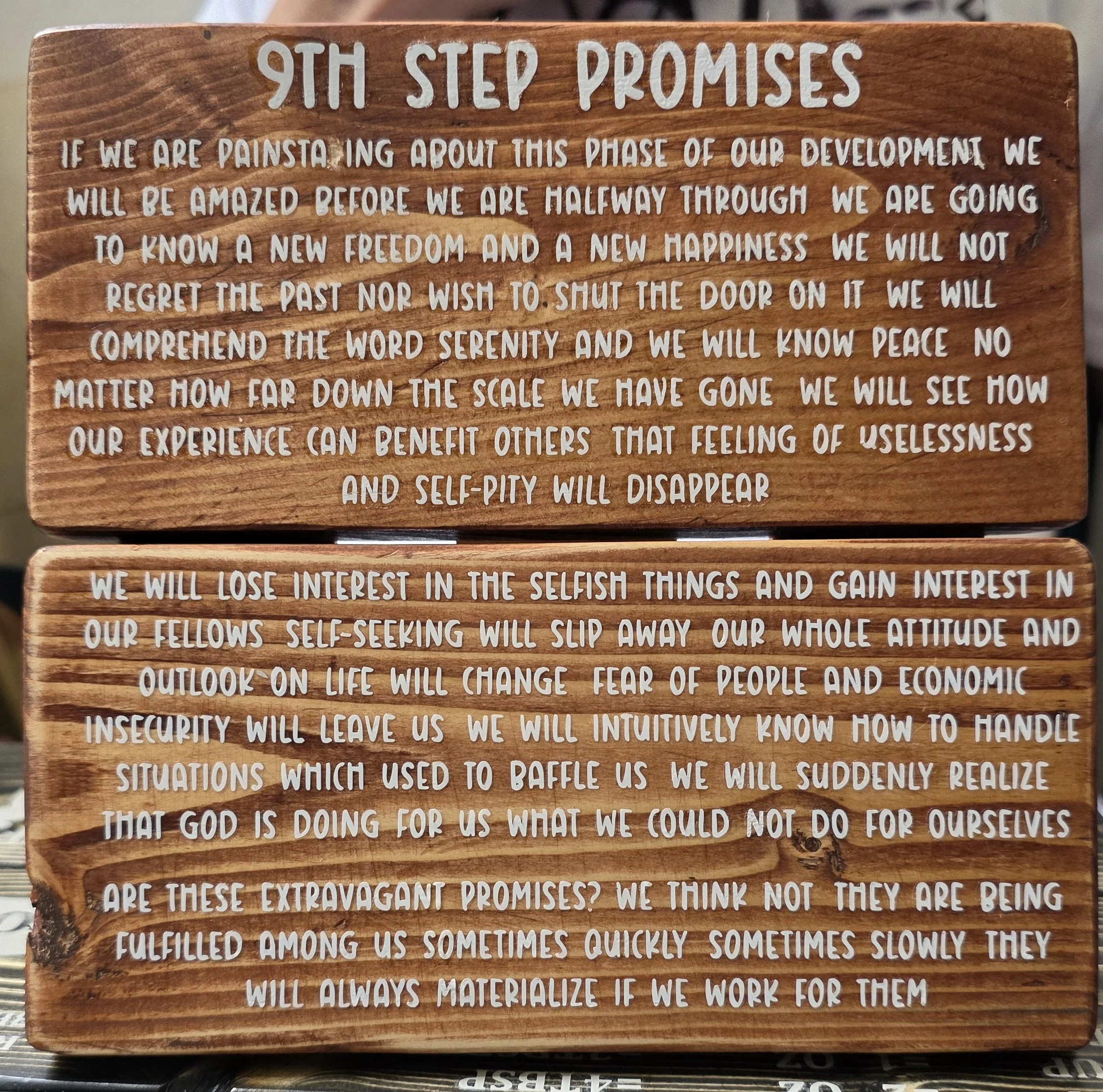 Wooden plaque with engraved white text titled '9TH STEP PROMISES' with an inspirational message about growth and self-awareness.