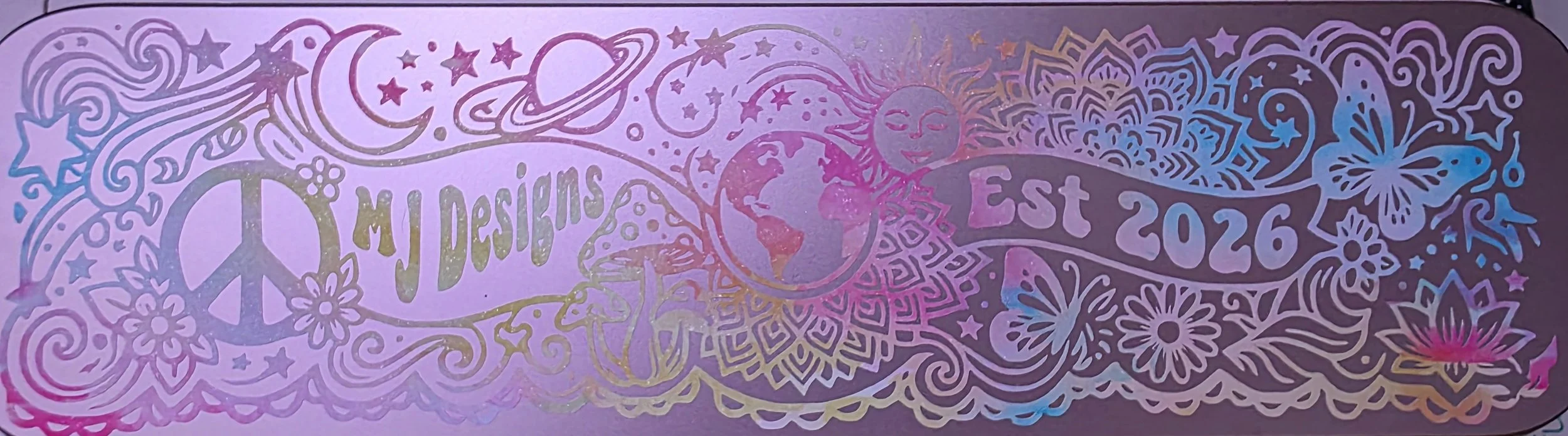 A colorful, holographic illustration featuring space, celestial bodies, flowers, a sun, a moon, a butterfly, and the words 'Jesus Loves' and 'Est 2026'.