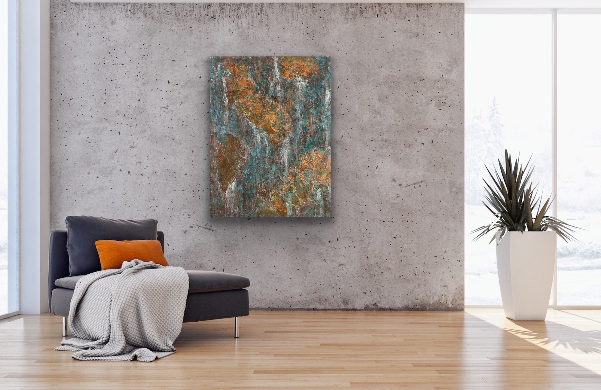 Modern living room with gray concrete wall, abstract textured artwork, black lounge chair with orange and gray pillows, knitted throw blanket, large potted plant, and bright natural light from large windows, with light hardwood floor.