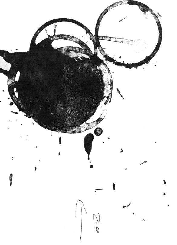 Black and white photo of spilled ink or paint with several circular ink splatters and drips.
