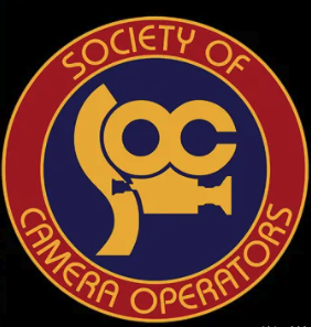 SOCIETY OF CAMERA OPERATORS logo with a yellow camera icon inside a blue circle and red border.