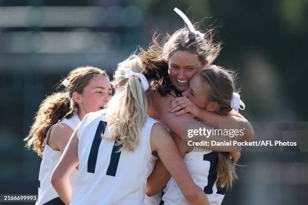 Young athletes celebrating together, representing oral health care and custom sports mouthguards for Adelaide sporting clubs.