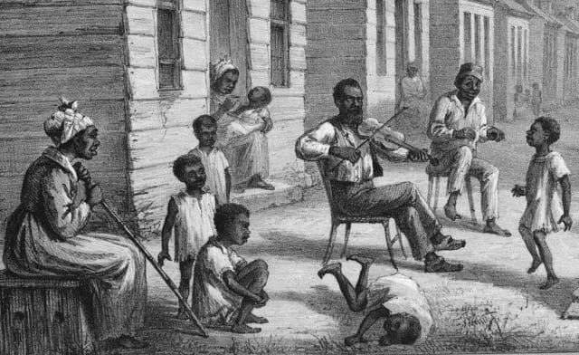 Black and white illustration of a diverse group of African American children and adults outside a wooden building, with two men playing guitars and children dancing or watching.