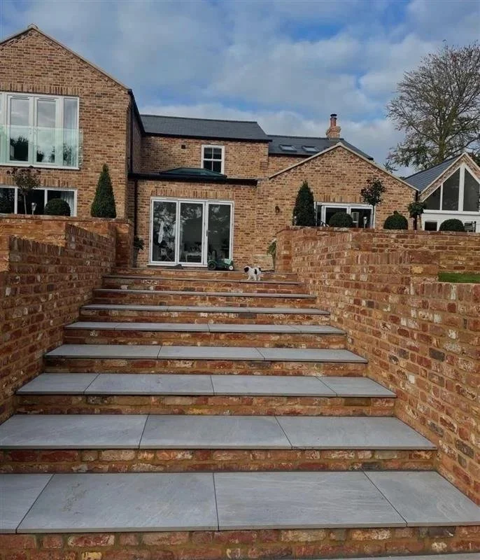 Completed new home build with brickwork, porcelain steps and patio in Norfolk.