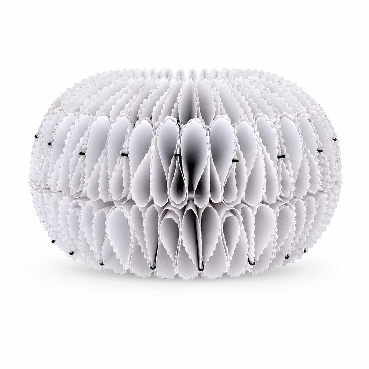 Side view of a white NJITS lampshade with layered folds and black metal clips.