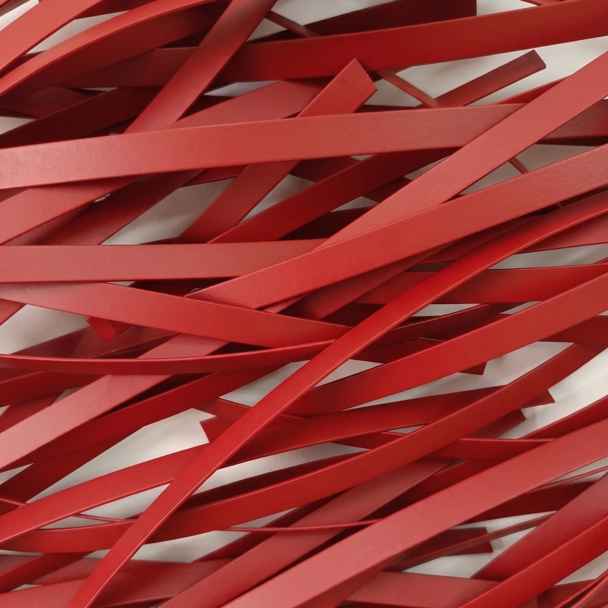 red-geometric-metal-art-texture-close-up.jpg
