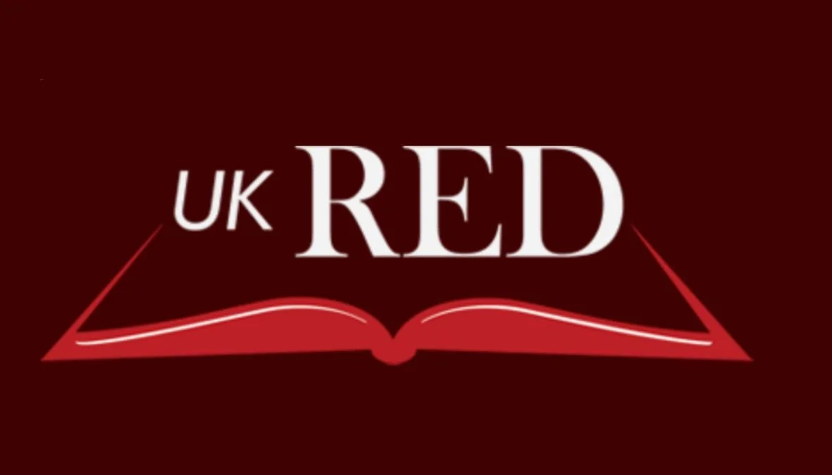 Logo with an open book illustration and the words "UK RED" in white on a dark red background.