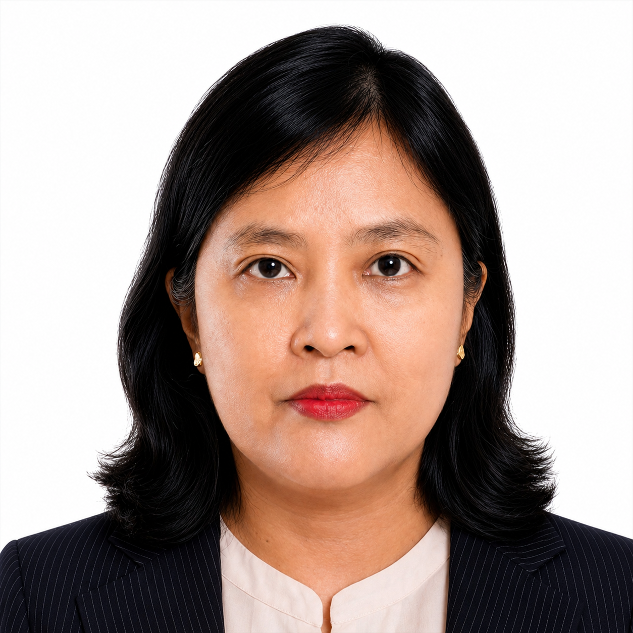 A woman with black hair wearing a dark pinstripe blazer and earrings, looking directly at the camera.