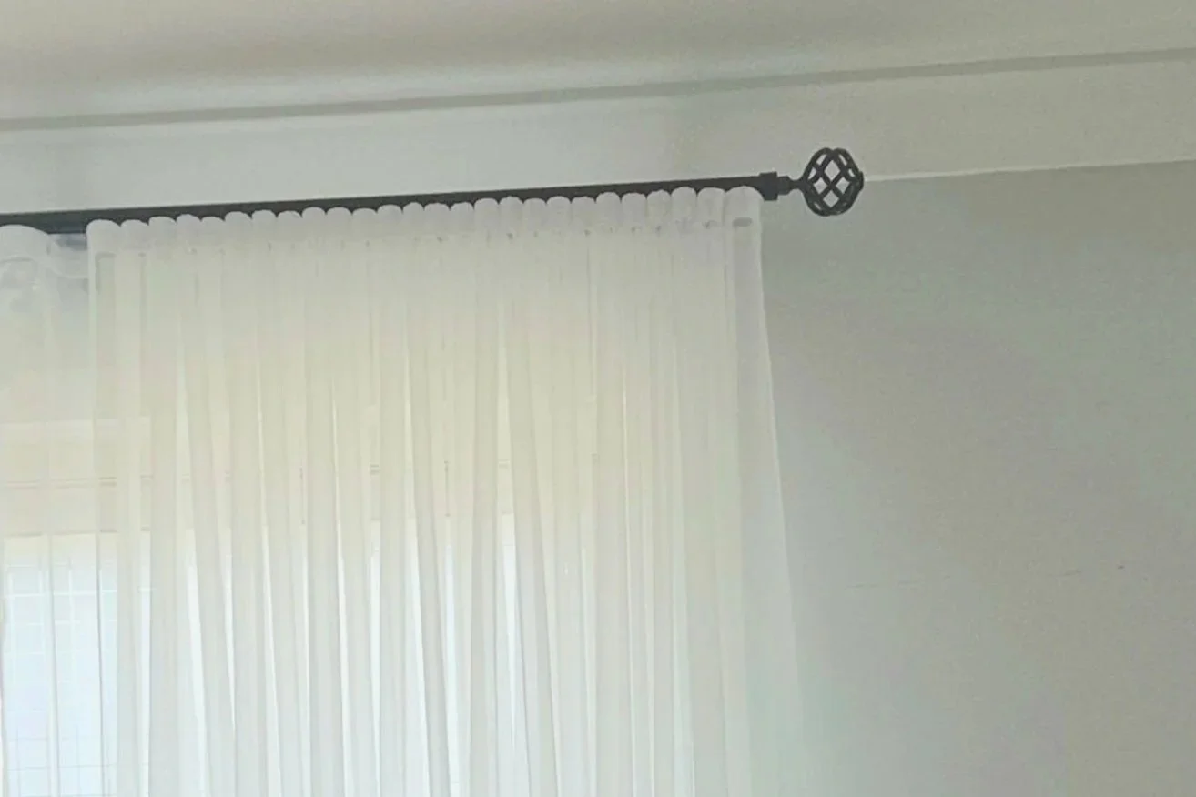 SFold Sheer on a Tube slider track with decorative finial