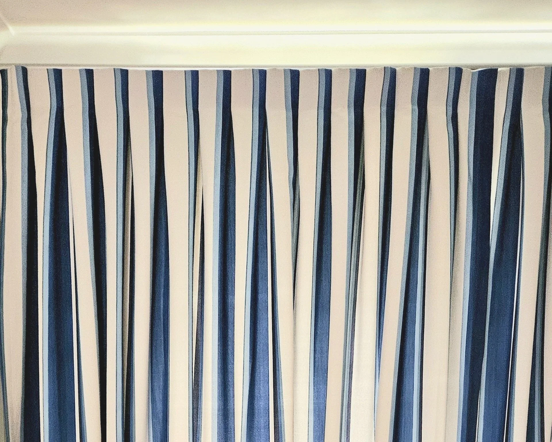 Box pleat curtain made in a striped fabric