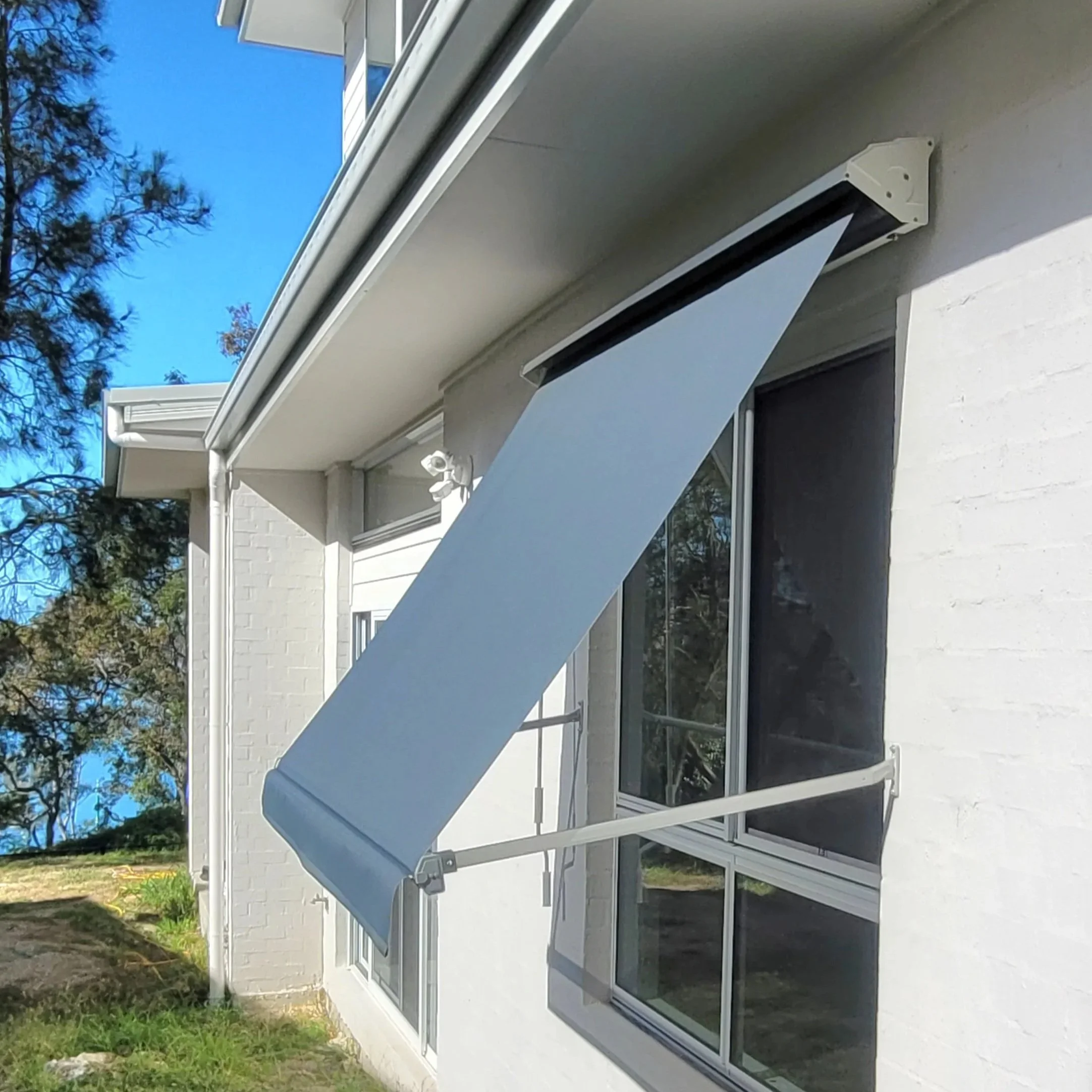 Pivot arm awning