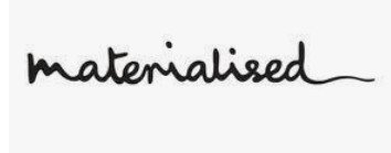 Handwritten word 'materialised' in black ink on white background.