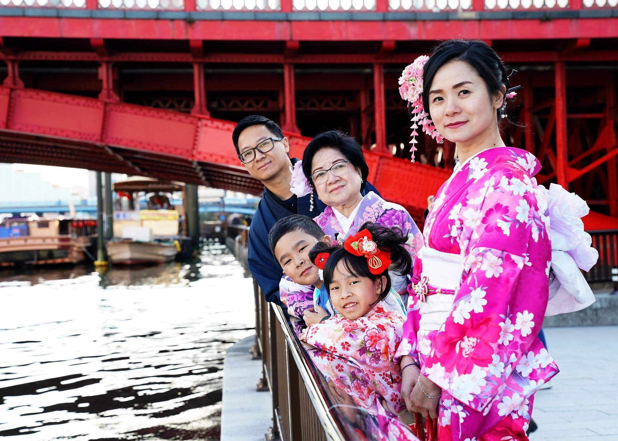 Multi-generation family in kimono by the Sumida River in Tokyo