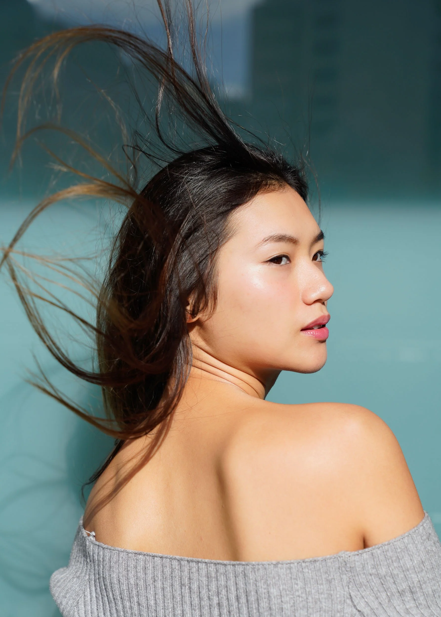 environmental-portraiture-windswept-hair-off-shoulder-sweater-tokyo-japan.jpg