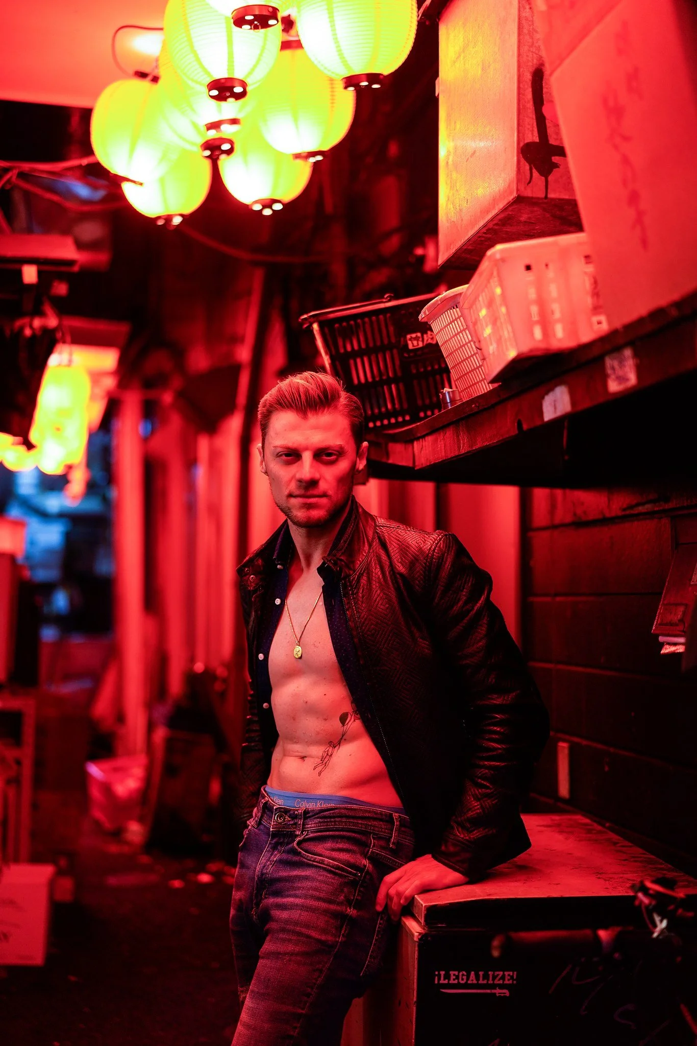 Editorial portrait in red neon light with green lanterns in Shinjuku