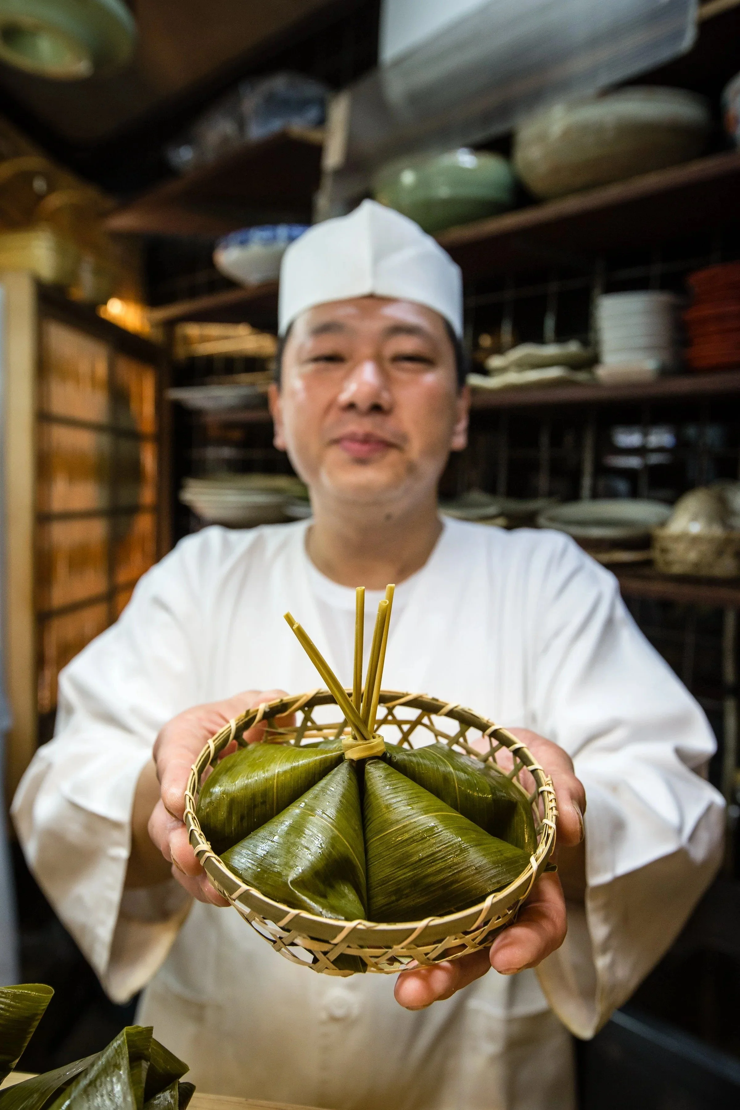 chef-traditional-attire-presents-basket-fresh-tokyo-food-photographer.jpg