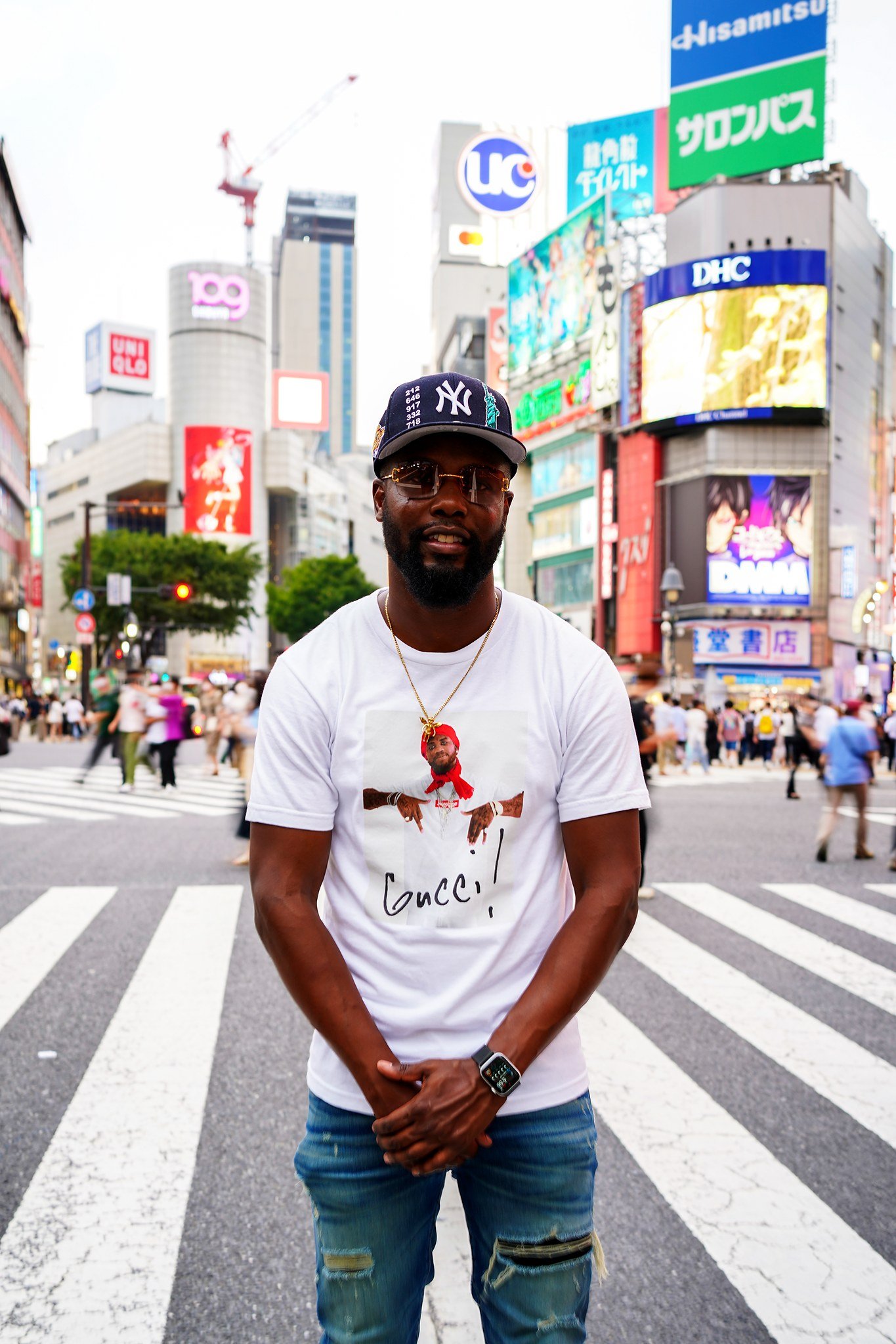 Smiling man on the Shibuya Crossing crosswalk