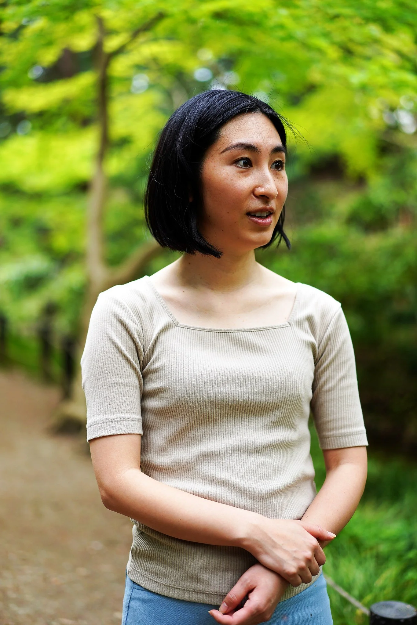 Woman in a lush green Tokyo garden