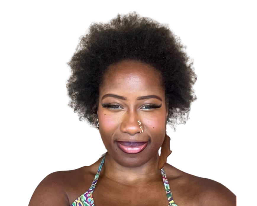 Close-up of a woman with natural curly hair, wearing makeup, a nose piercing, and a colorful swimsuit top, smiling against a white background.