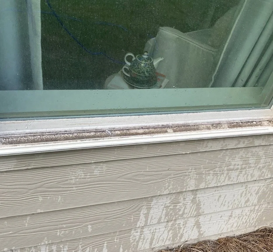 Before window cleaning by Hearn Exterior Services.
