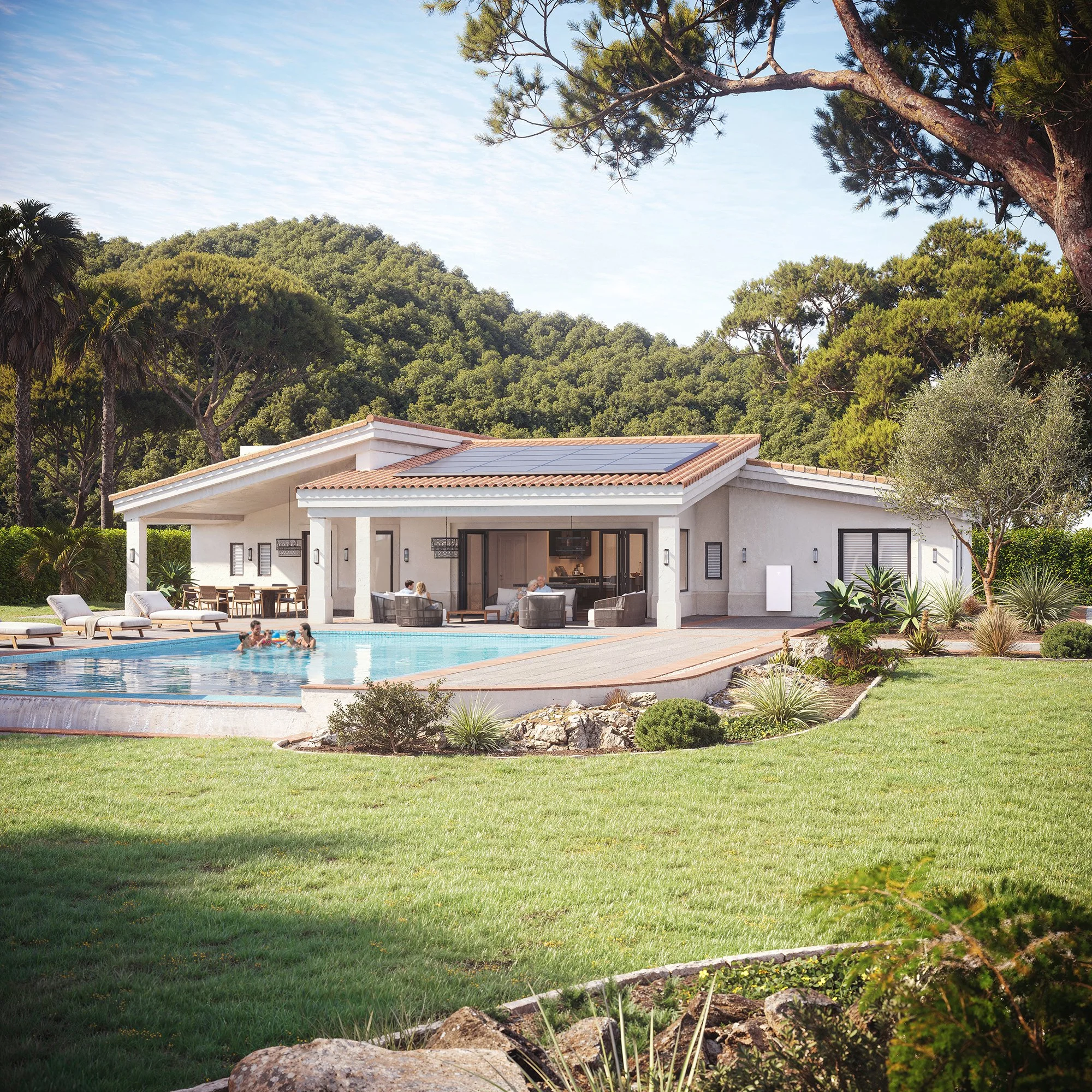 A backyard with a swimming pool, white house with solar panels, and lush green trees and bushes surrounding the area, under a partly cloudy sky.
