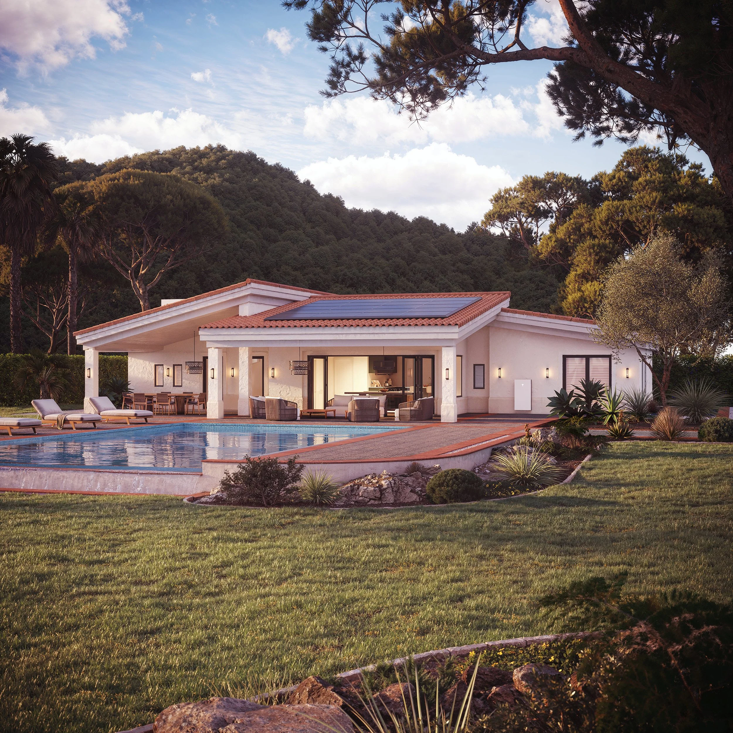 A house with a television, outdoor patio furniture, and a swimming pool in front, set against a hillside covered with trees under a partly cloudy sky during the daytime.