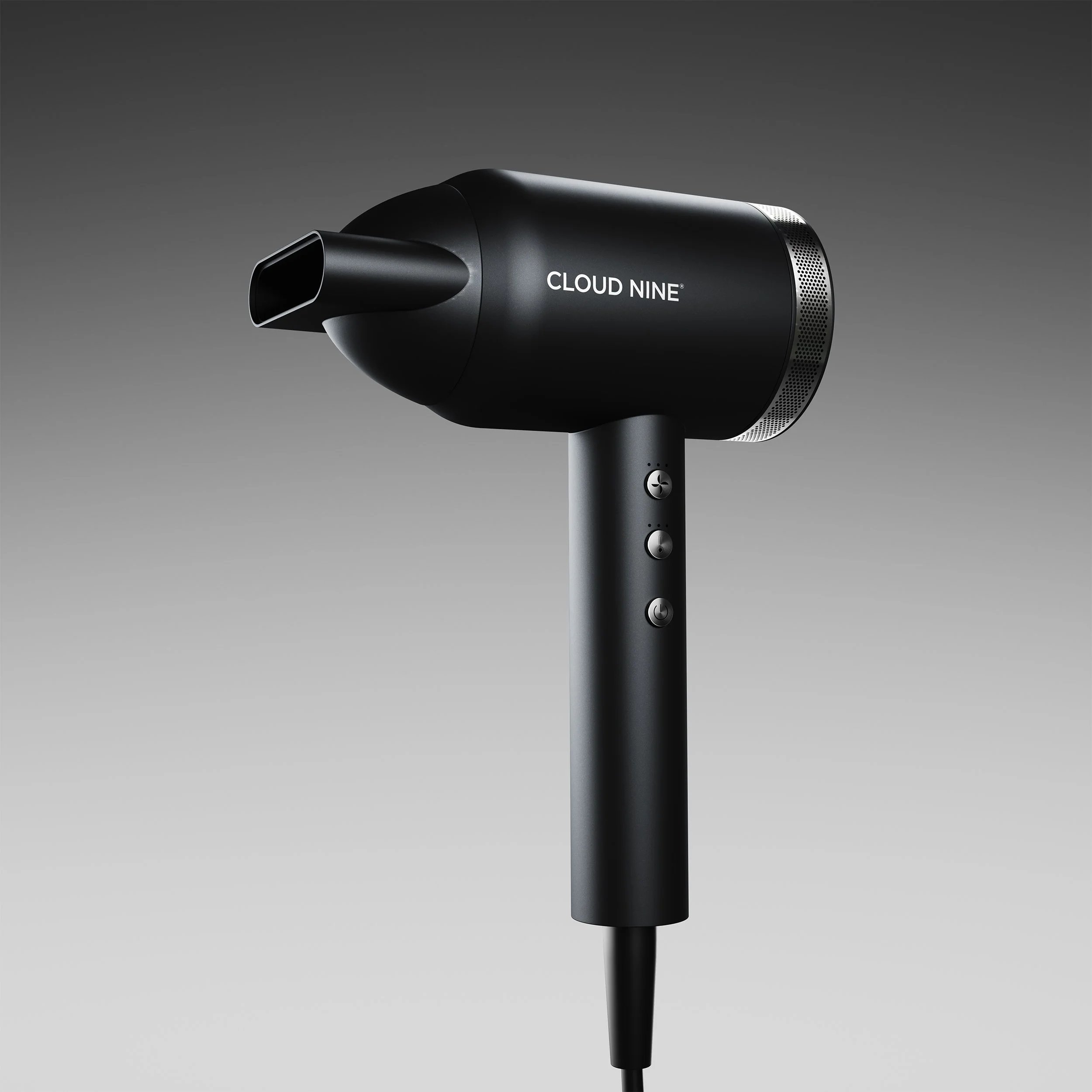 A black hair dryer with the brand name 'CLOUD NINE' written on the side, shown against a gray background.