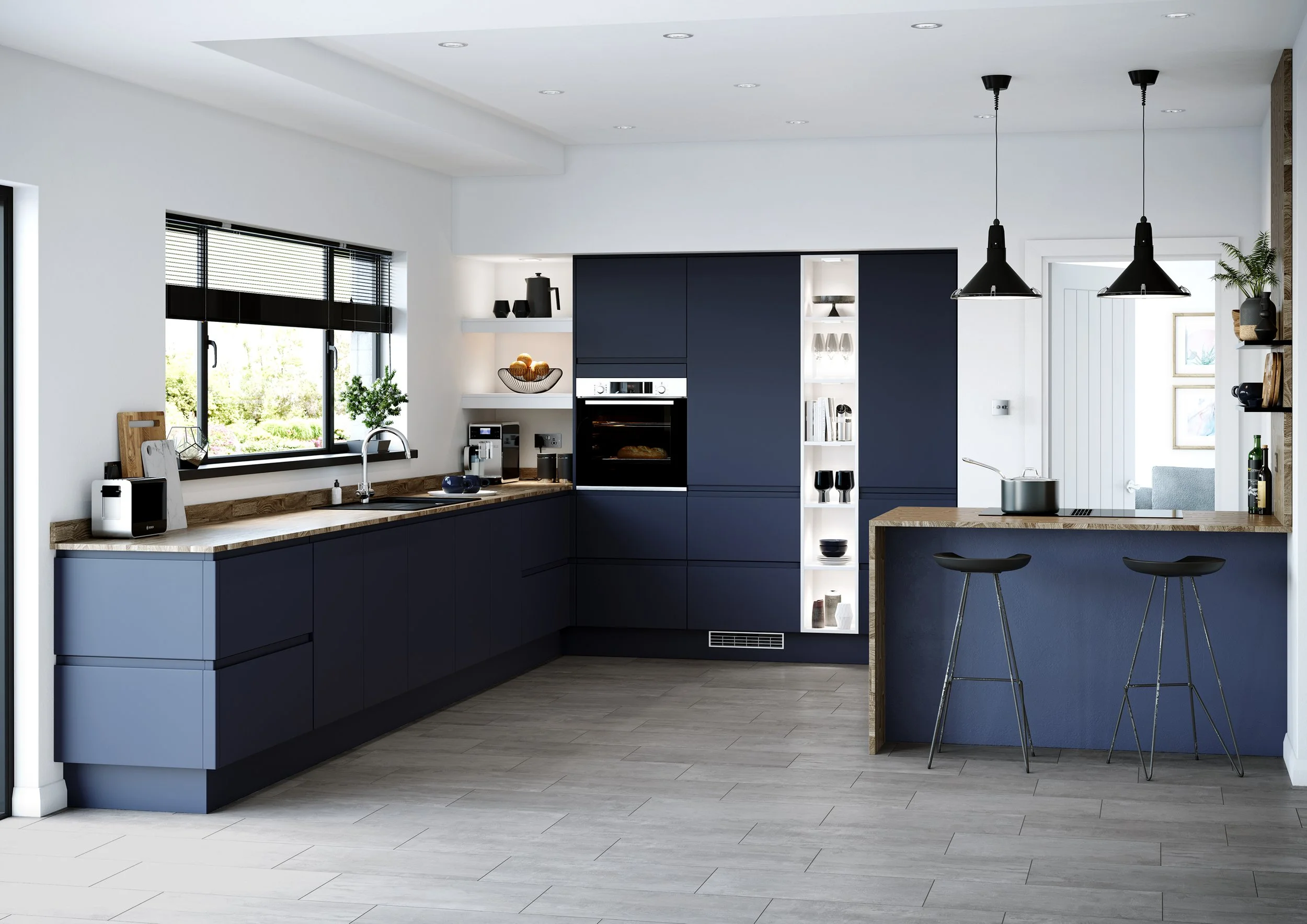 Modern kitchen with navy blue cabinets, wooden countertops, large window with blinds, white walls, black pendant lights over a small bar area, and decorative items on open shelves.