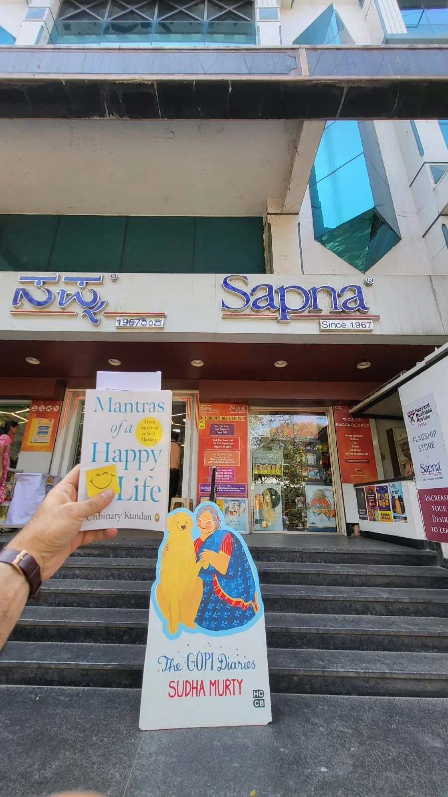 Kundan facilitating a book launch event at the book signing event in Mysore. 