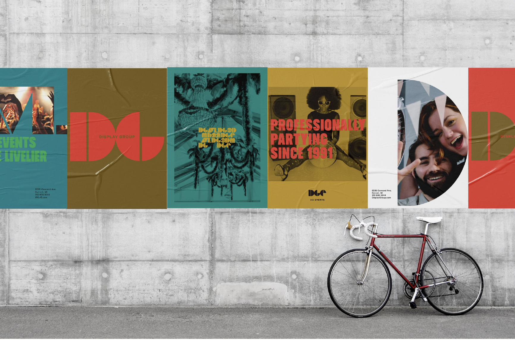 Colorful urban wall with posters advertising events, entertainment, and parties, and a red bicycle parked against the wall.