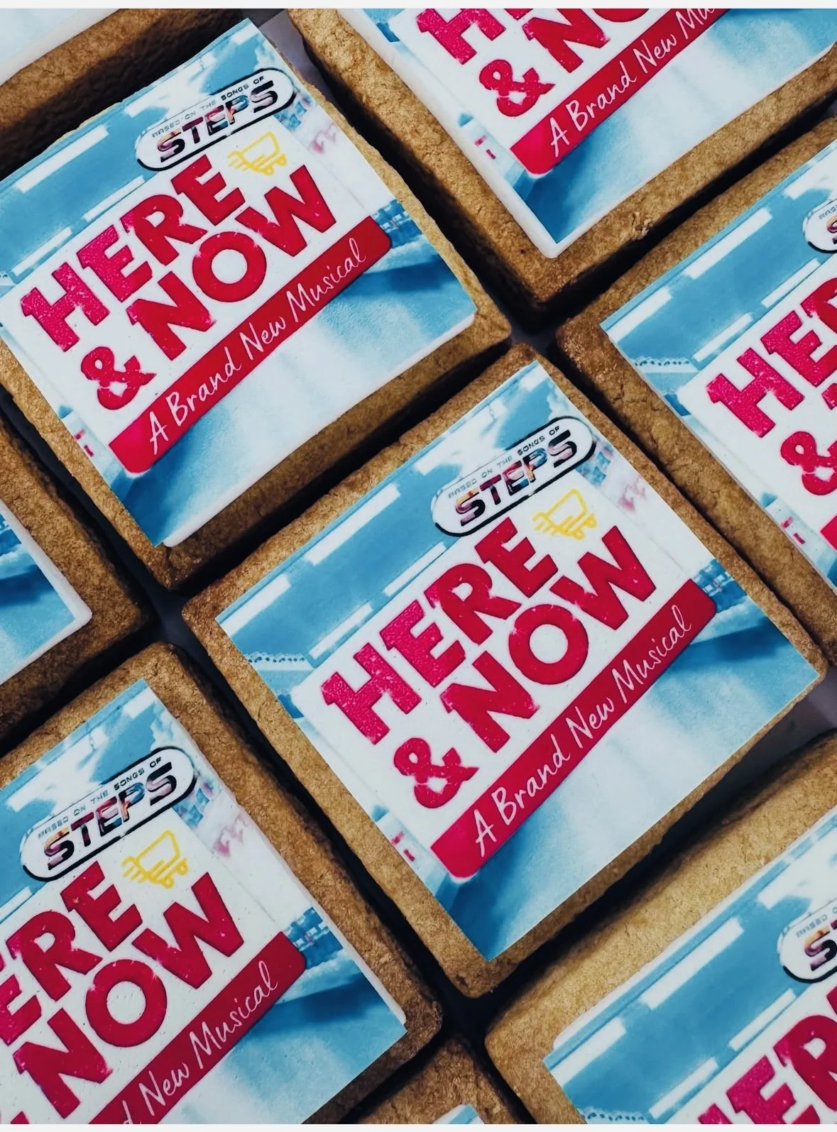 Close-up of multiple Broadway show posters for 'Here and Now,' a new musical, arranged in a grid.
