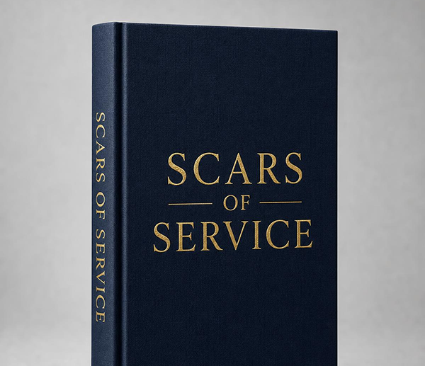 Navy blue hardcover of SCARS OF SERVICE with gold lettering on the cover and spine.