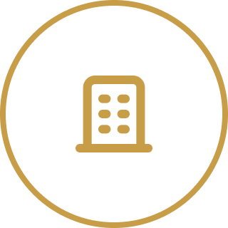 Icon of a building or skyscraper inside a circular border.