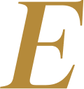 Close-up of a black background with a large gold letter 'E' in a decorative font.