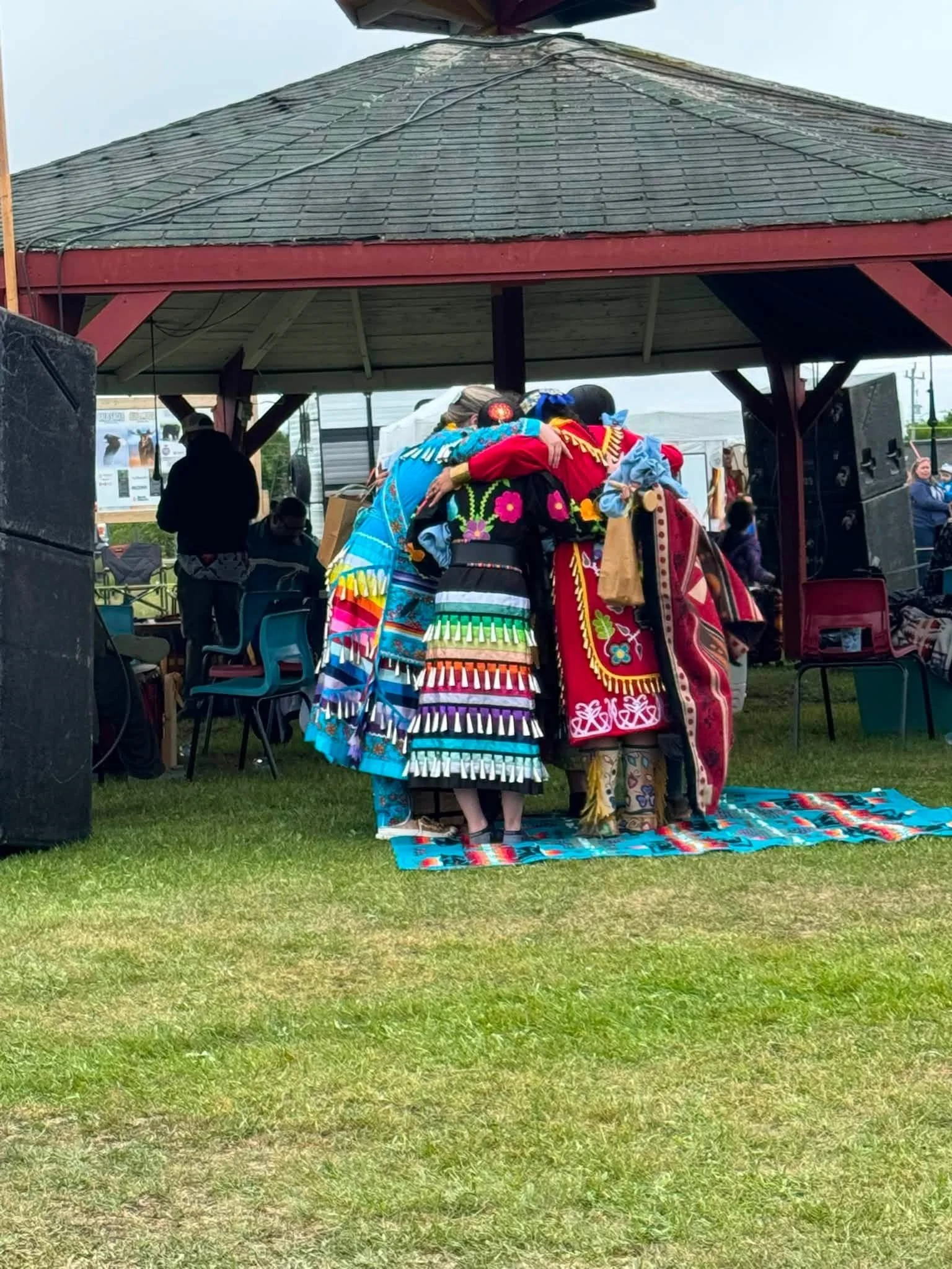 Jingle Dress Dancers Hugging at Special