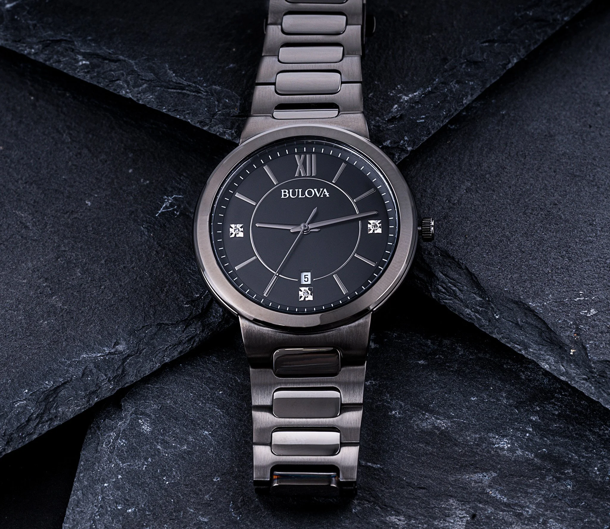 Bulova watch with band with soft lighting to reduce glare and reflections. Macro details to showcase the watch dial