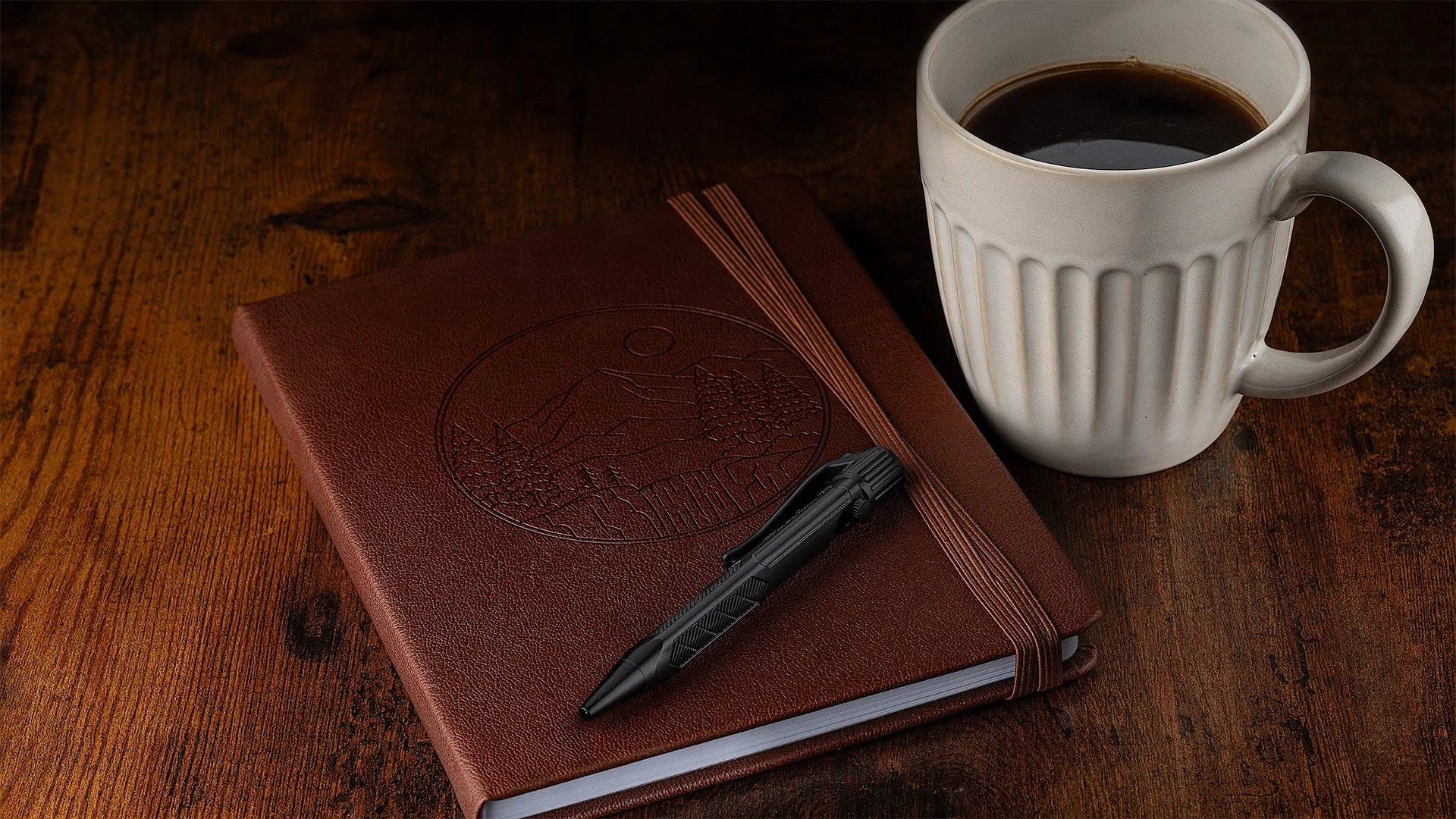 Leather-bound journal with bolt action pen and coffee mug showcasing mood lighting and enhanced macro details
