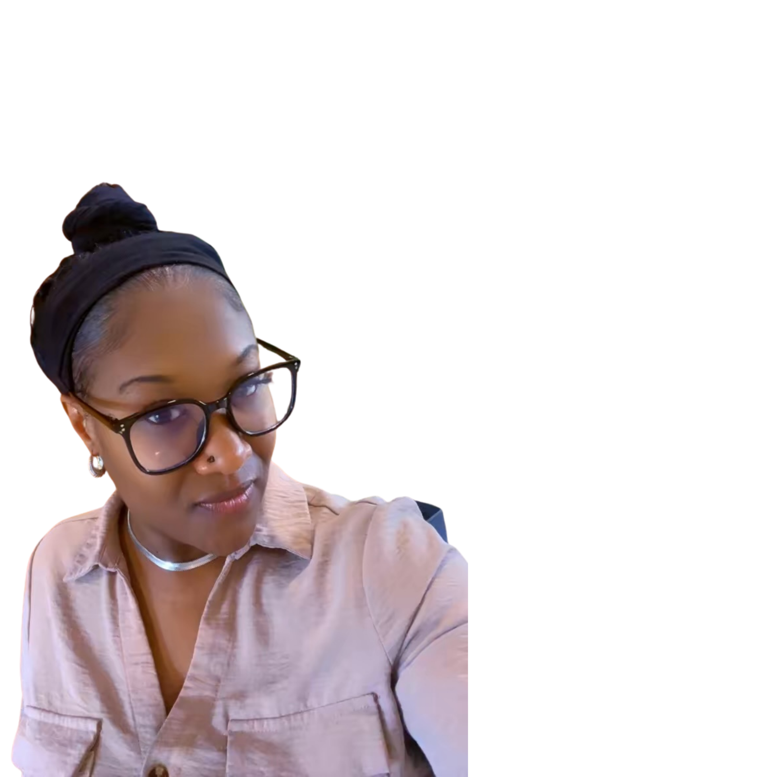 Close-up of a woman with glasses, wearing earrings, and a bun hairstyle, looking slightly downward.