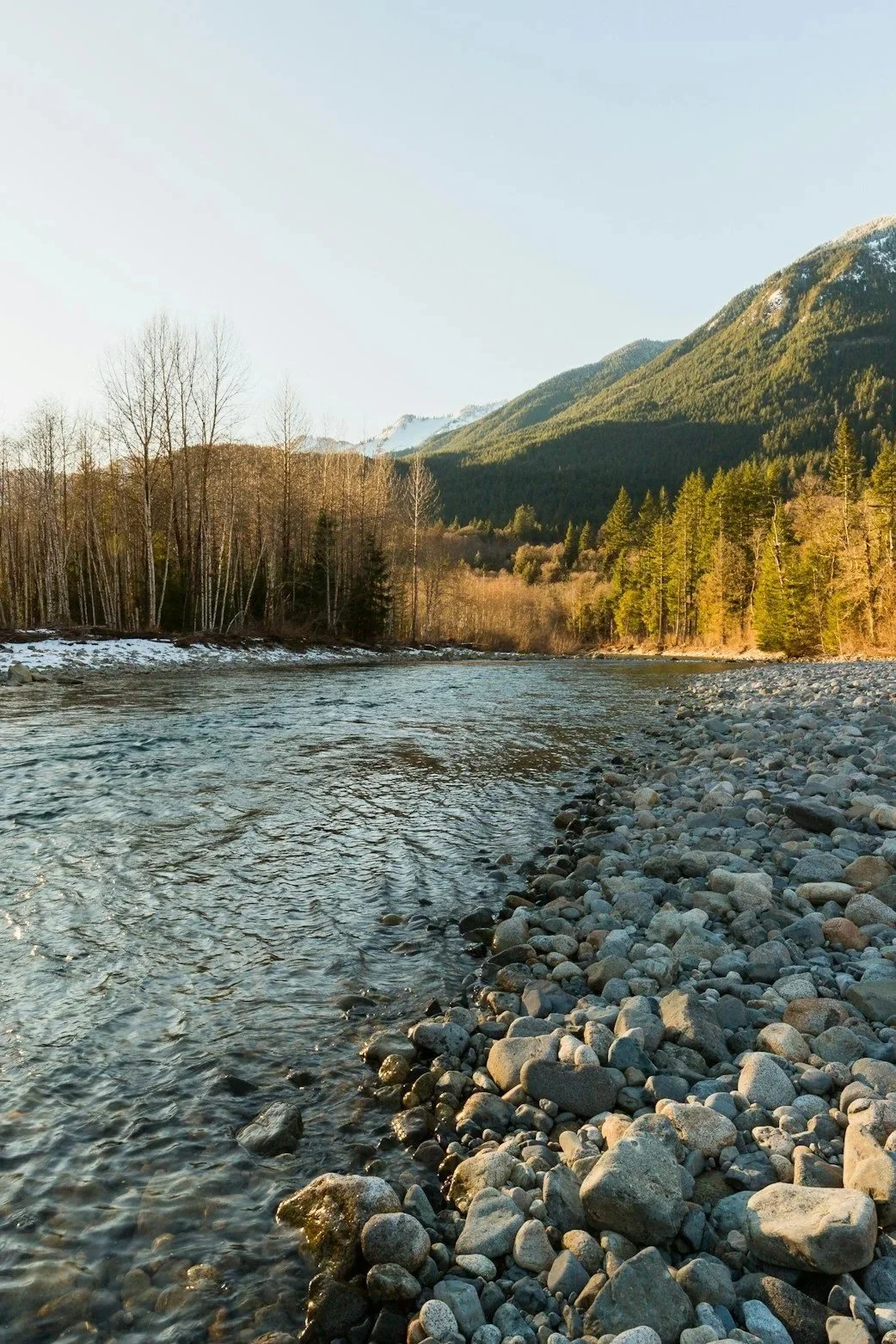 Still water flowing through a peaceful mountain landscape representing God's peace, emotional healing, faith, and personal growth with B. Stillwater.