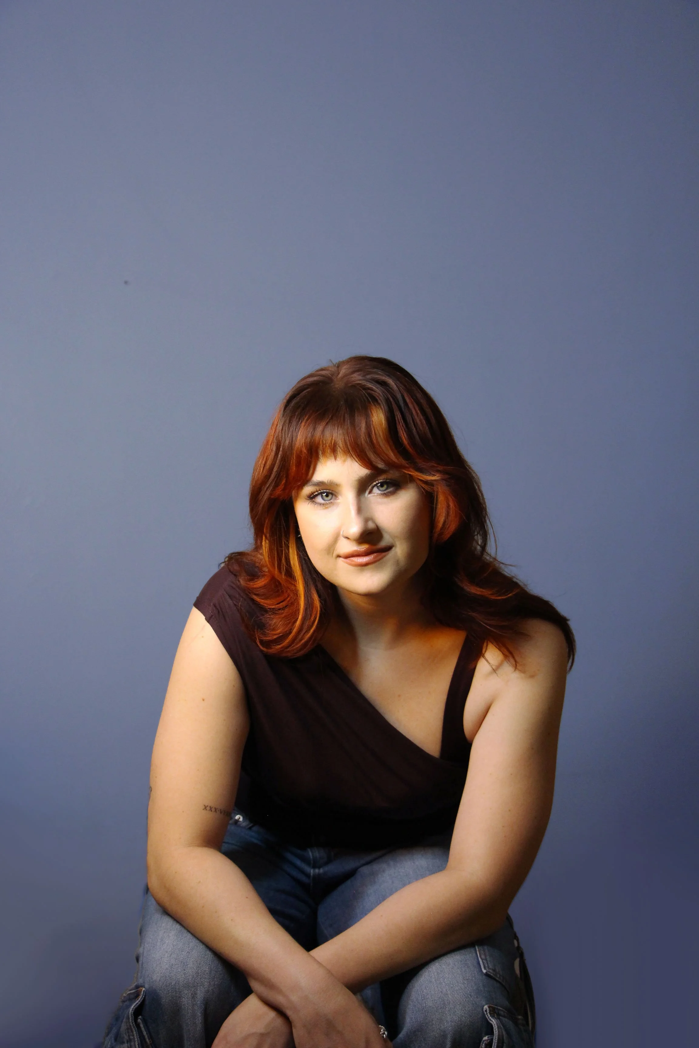 2-Sitting-Purple-BG.jpg