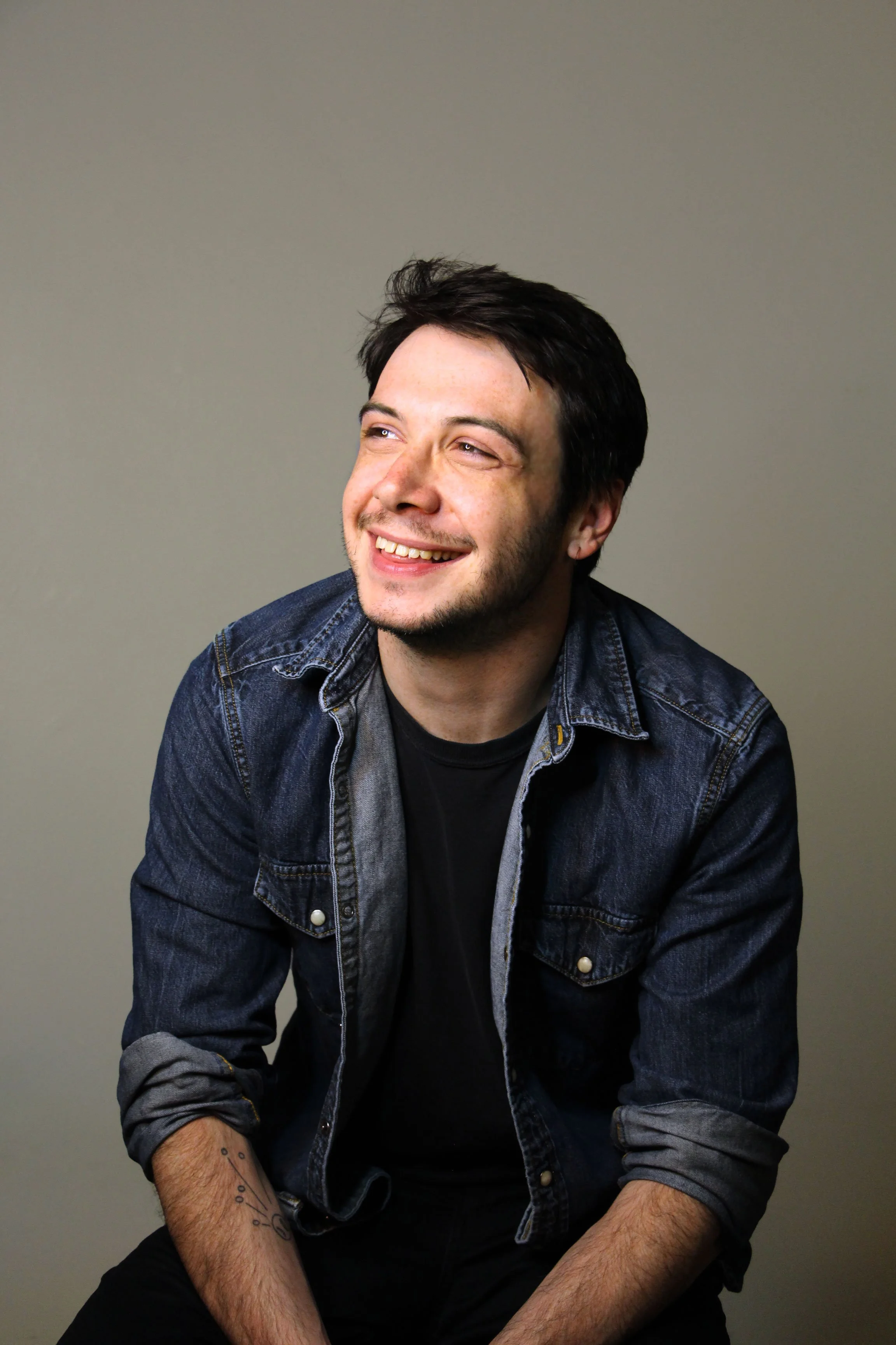 1-Sitting-Smile-Neutral-BG.jpg