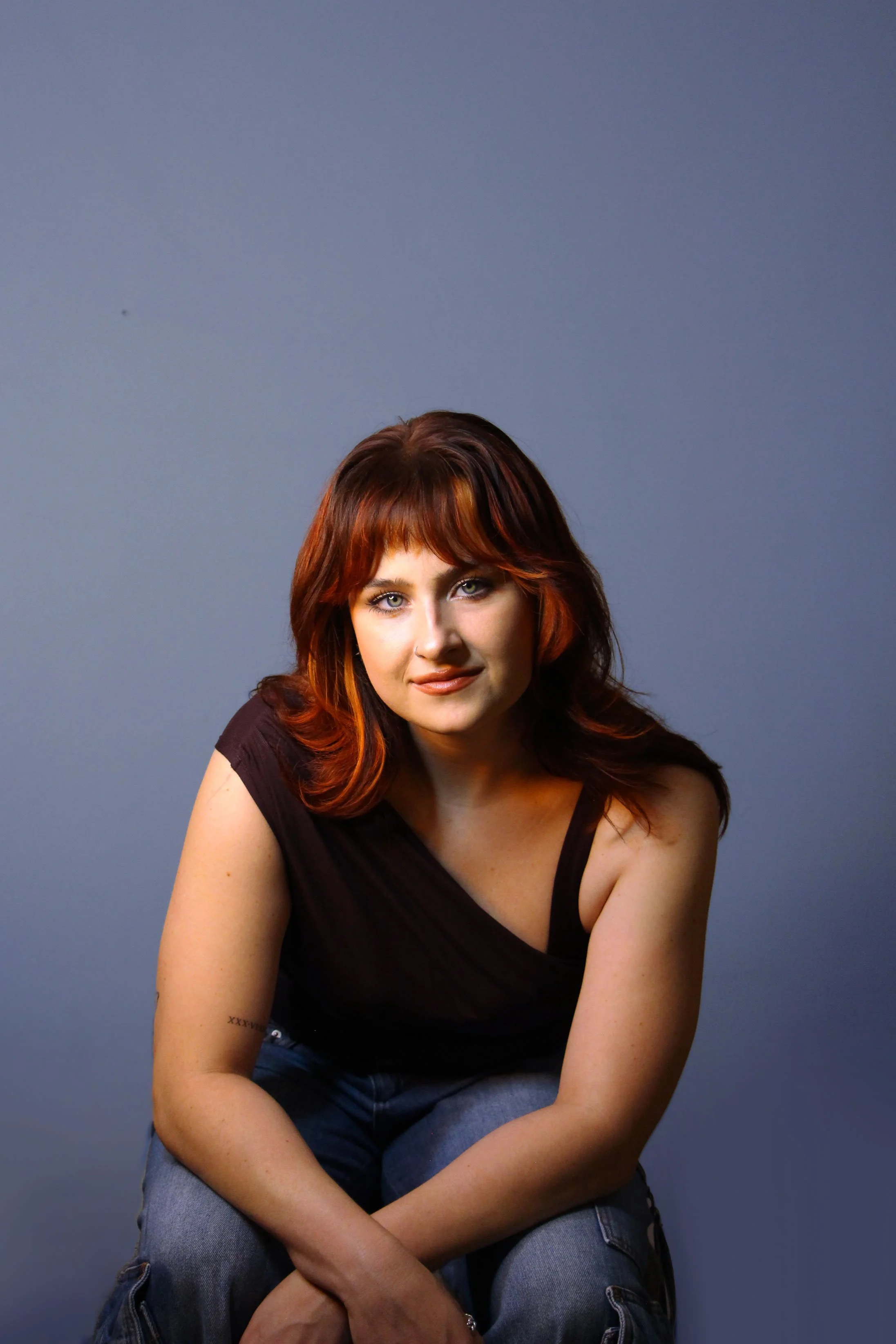 2-new-sitting-blue-bg.jpg